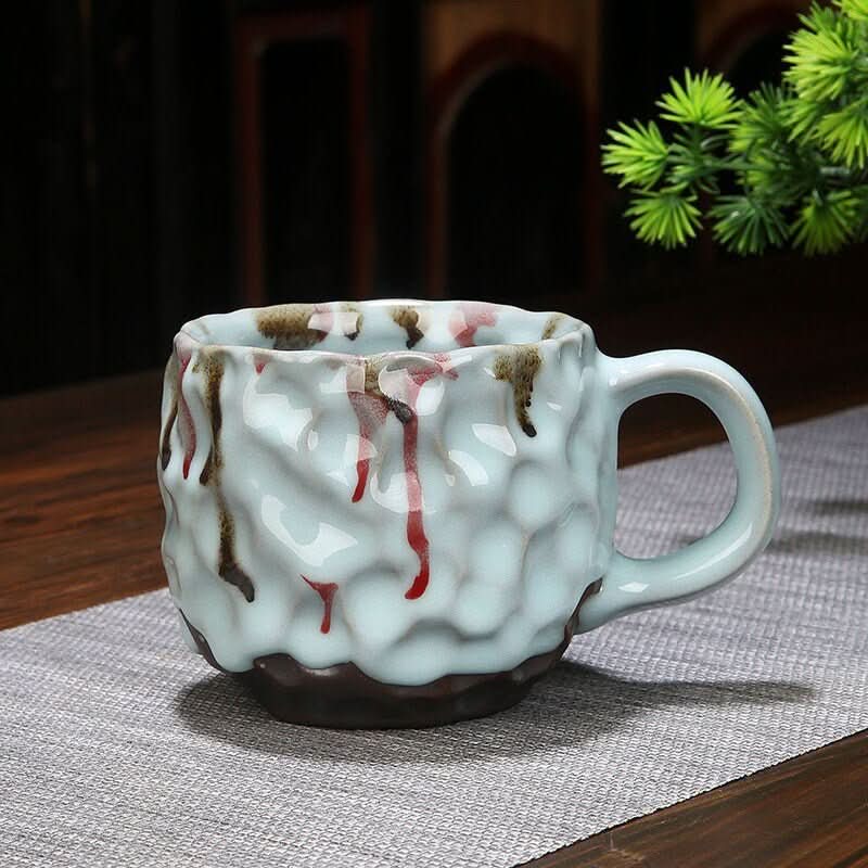 Retro Handmade Stoneware Coffee Cup: reactive glaze drips on textured pottery.